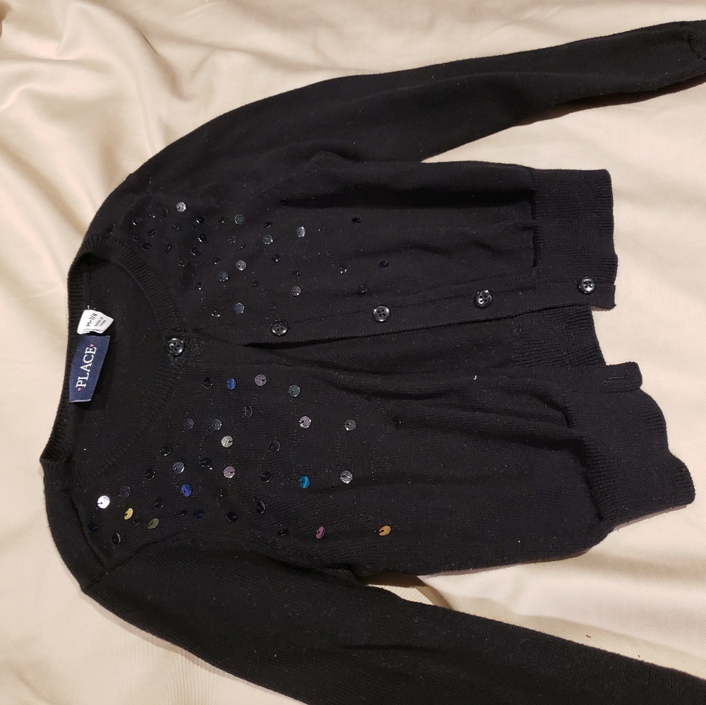 Black cardigan with rainbow like sequins on front